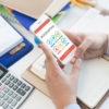 man-using-a-phone-with-accounting-app-Knowledge-Webcast