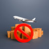 Cargo plane, boxes and red prohibition symbol NO. Embargo, a ban on commercial aircraft. Sanctions. Restrictions on export of strategically important goods and resources. Lack of transport capacity