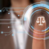 Lawyer touching virtual screen with scales icon, closeup