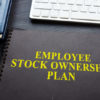 Employee Stock Ownership Plan (ESOP) on a desk.