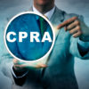 Unrecognizable business manager pointing at a CPRA icon signifying the California Privacy Rights Act. Business and technology metaphor for data privacy, compliance and consumer rights legislation.