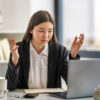 Young business lady working on laptop in office, Asian beautiful businesswoman in workplace.